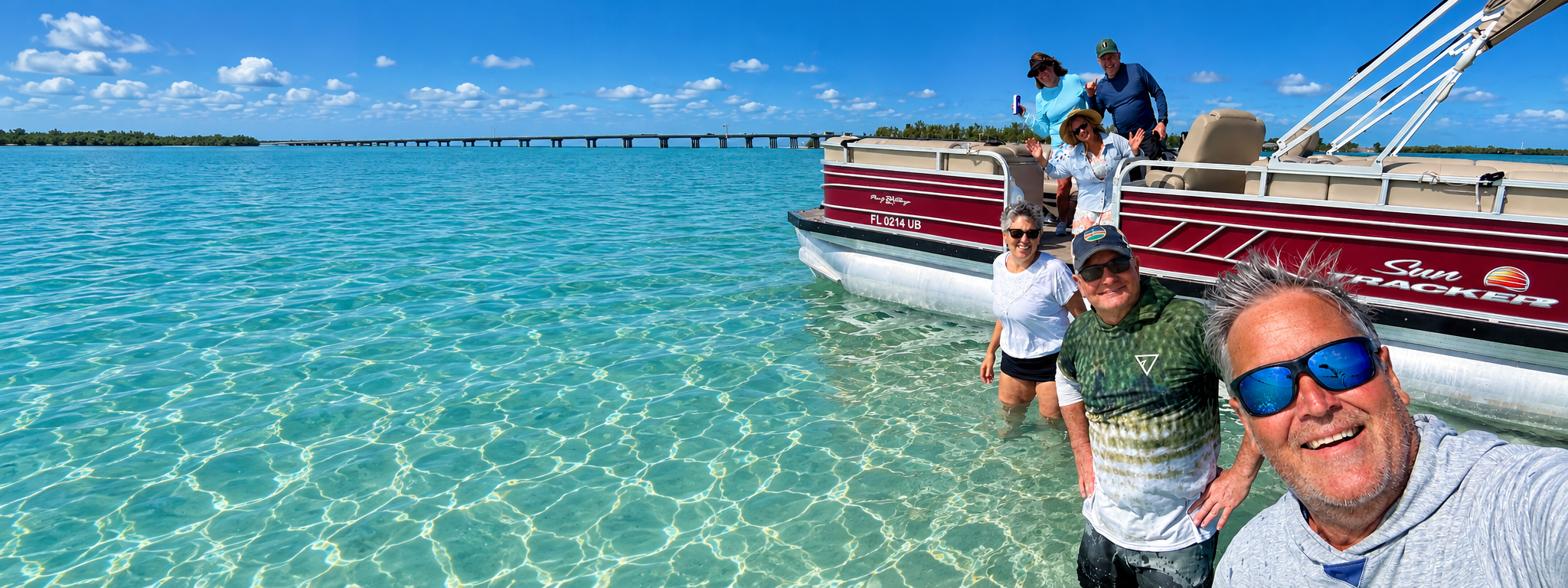Guests enjoying a boat day on clear Gulf Coast water near Cortez