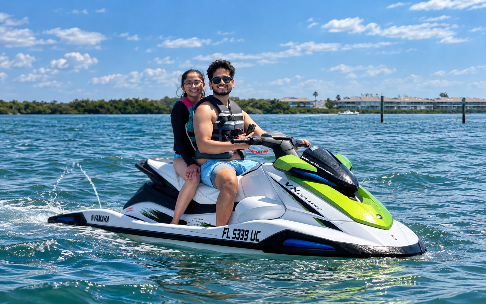 Guests riding a Little Philly jet ski on clear Florida water