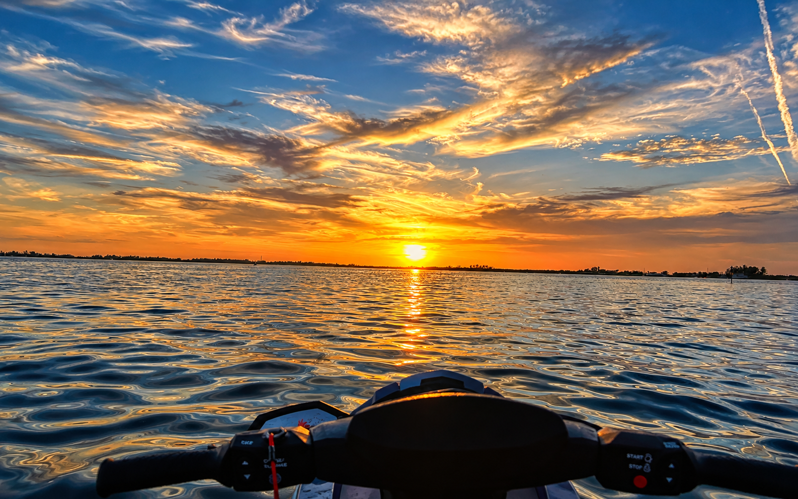 Sunset view from a Little Philly jet ski on coastal water