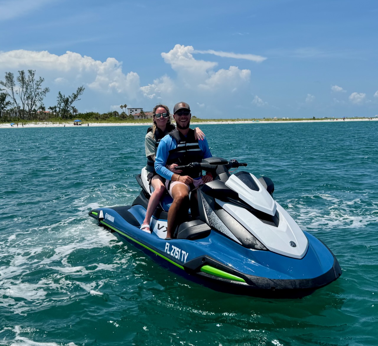 Couple enjoying a jet ski on Gulf water